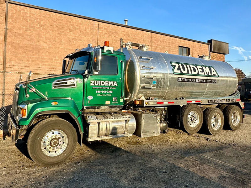Green and silver colored Zuidema septic truck in New York & New Jersey.
